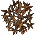 Star anise seeds on a white background